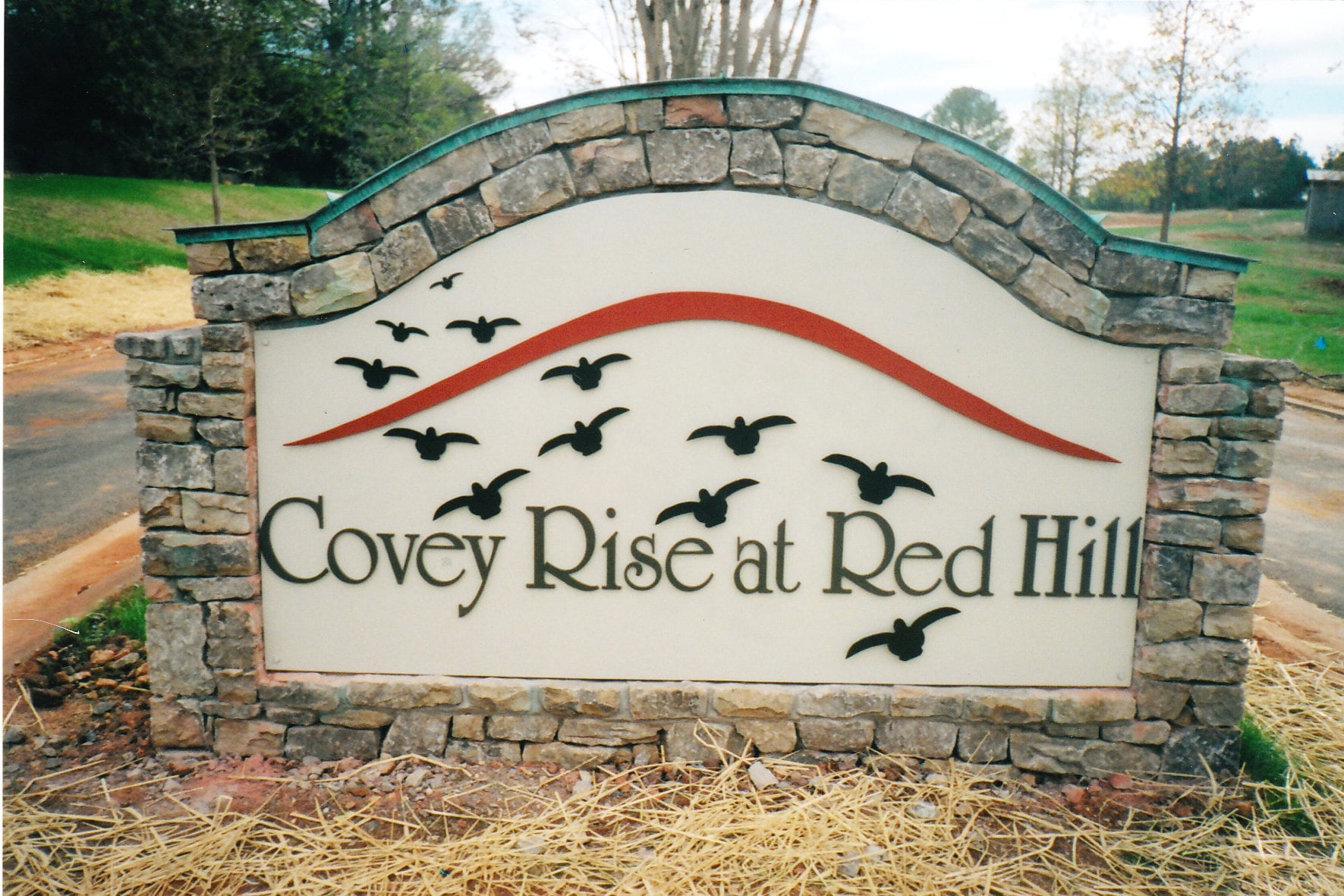 Covey Rise at Red Hill neighborhood entrance sign set in a stone monument